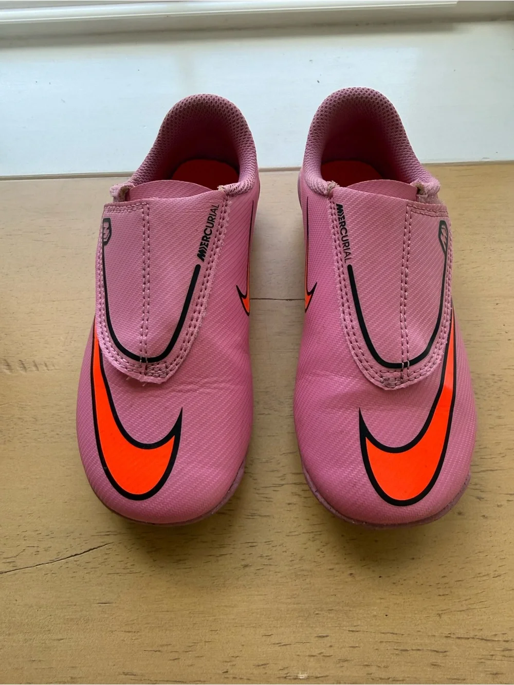 Nike Mercurial Kids Pink Soccer Cleats with Orange and Black Accents